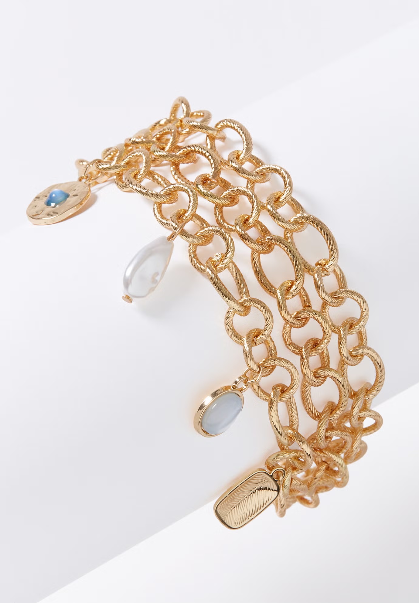 Three-Chain Charm Bracelet. 4 Three-Chain Charm Bracelet.