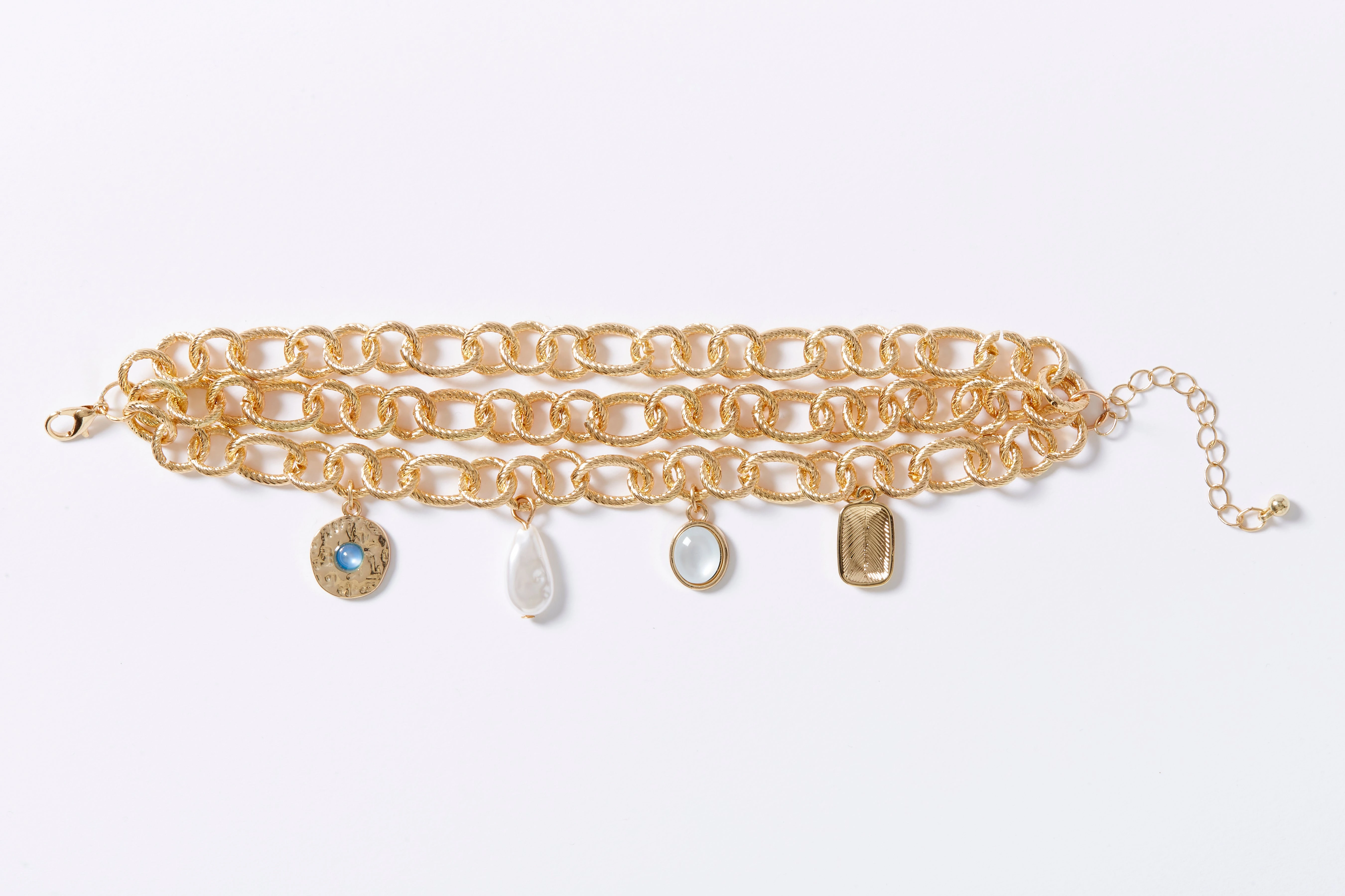 Three-Chain Charm Bracelet. 5 Three-Chain Charm Bracelet.